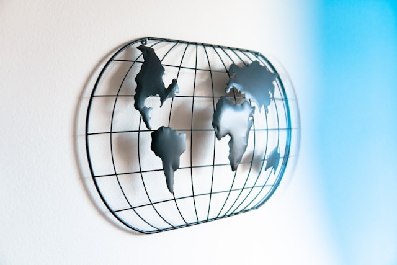 Steel decorative panel shaped like a globe with continents. Steel decorative panel shaped like a globe with continents.
